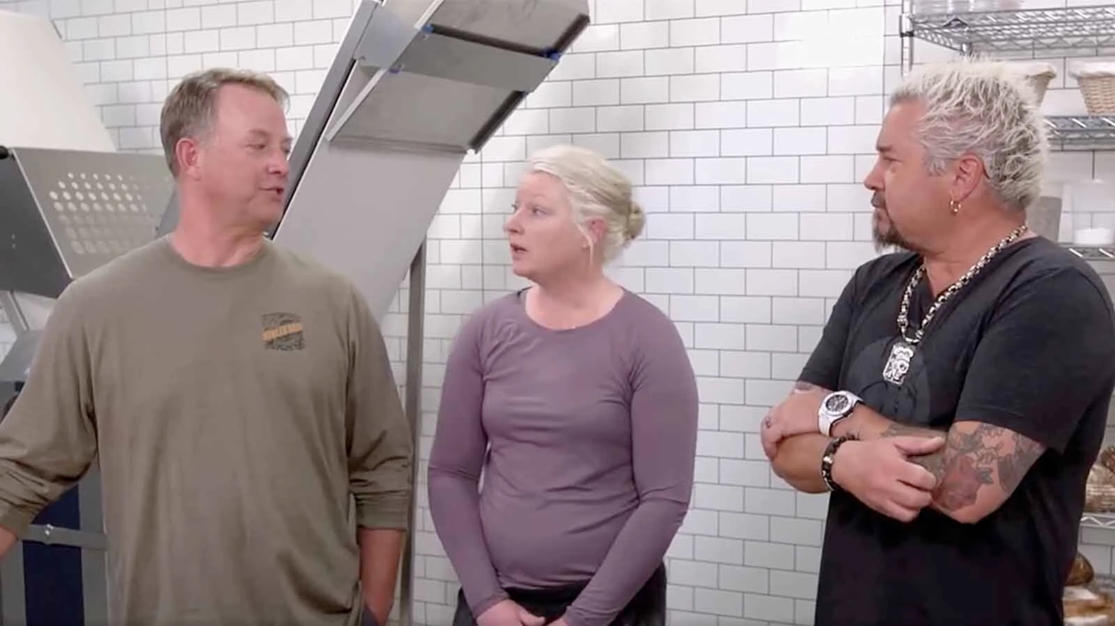 Alibi Wood Fire Pizzeria & Bakery owners Ethan and Kerri Smith with Guy Fieri on "Diners, Drive-Ins & Dives" in 2022.