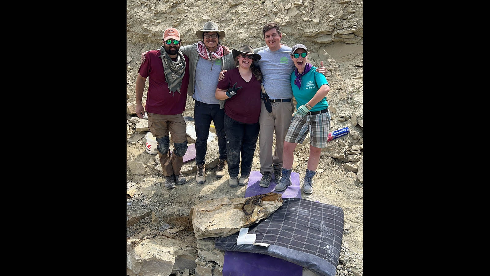 The paleontology team from the Children's Museum of Indianapolis celebrates the successful removal of the Allosaurus snout at the Jurassic Mile near Lovell. This 150-million-year-old Late Jurassic fossil is part of a remarkably well-preserved specimen that will reveal new insights on the life and times of Allosaurus.