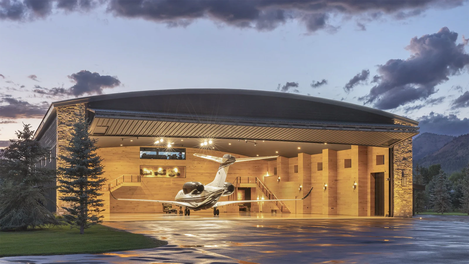 Next to the main residence is a state-of-the-art 9,650-square-foot airplane hanger with a direct taxiway to a runway. The hangar's mezzanine level is a unique space with a stone-clad fireplace and bar area perfect for entertaining.