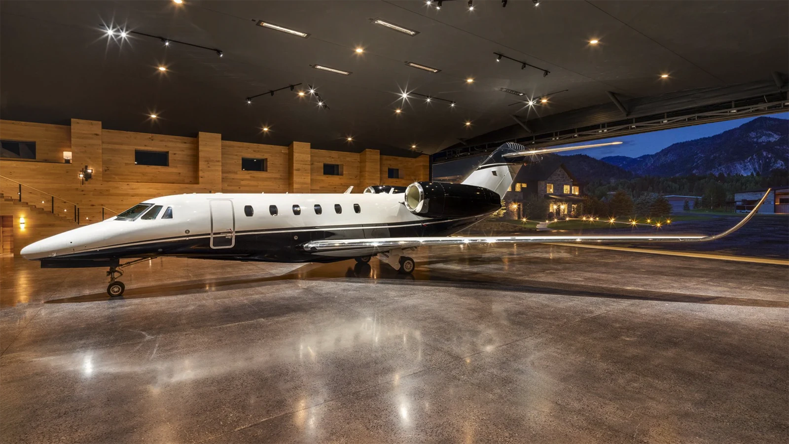 Next to the main residence is a state-of-the-art 9,650-square-foot airplane hanger with a direct taxiway to a runway. The hangar's mezzanine level is a unique space with a stone-clad fireplace and bar area perfect for entertaining.