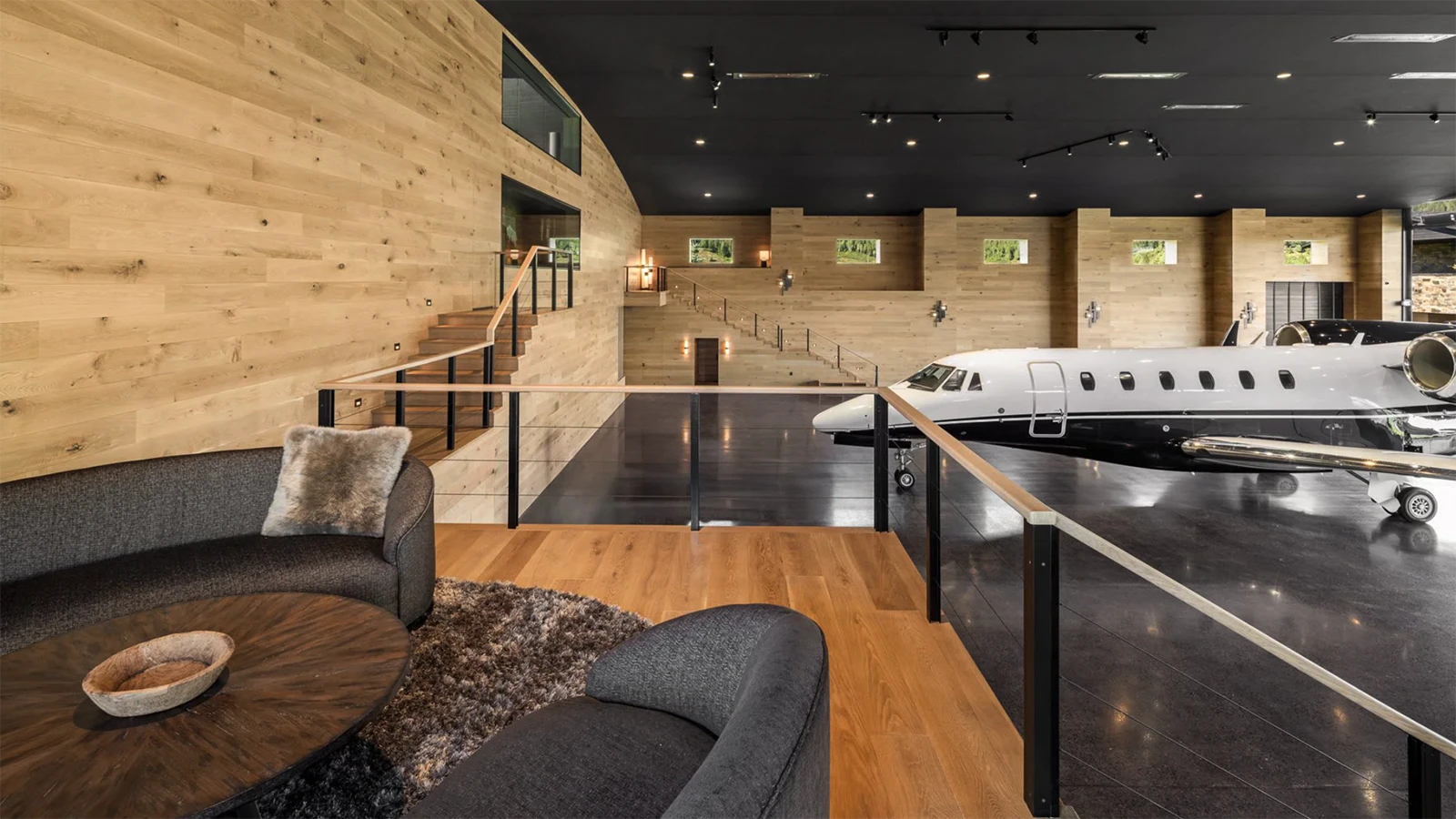Next to the main residence is a state-of-the-art 9,650-square-foot airplane hanger with a direct taxiway to a runway. The hangar's mezzanine level is a unique space with a stone-clad fireplace and bar area perfect for entertaining.