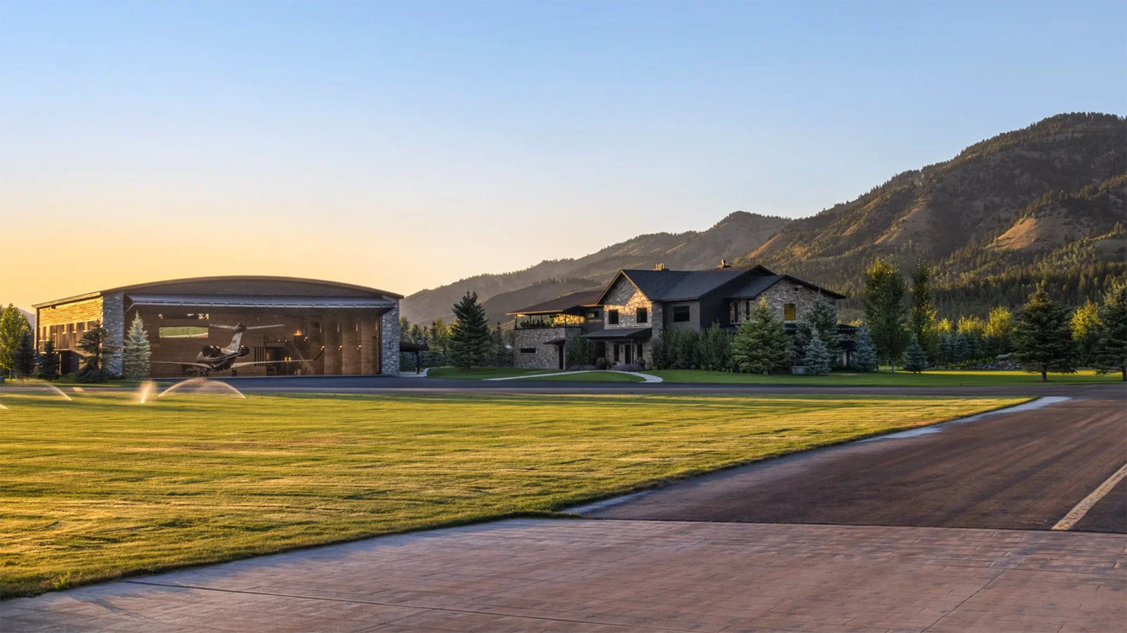 Next to the main residence is a state-of-the-art 9,650-square-foot airplane hanger with a direct taxiway to a runway. The hangar's mezzanine level is a unique space with a stone-clad fireplace and bar area perfect for entertaining.
