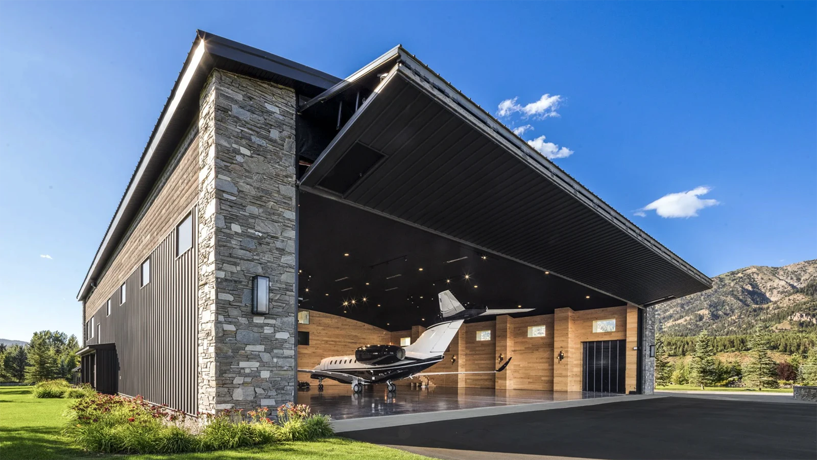 Next to the main residence is a state-of-the-art 9,650-square-foot airplane hanger with a direct taxiway to a runway. The hangar's mezzanine level is a unique space with a stone-clad fireplace and bar area perfect for entertaining.