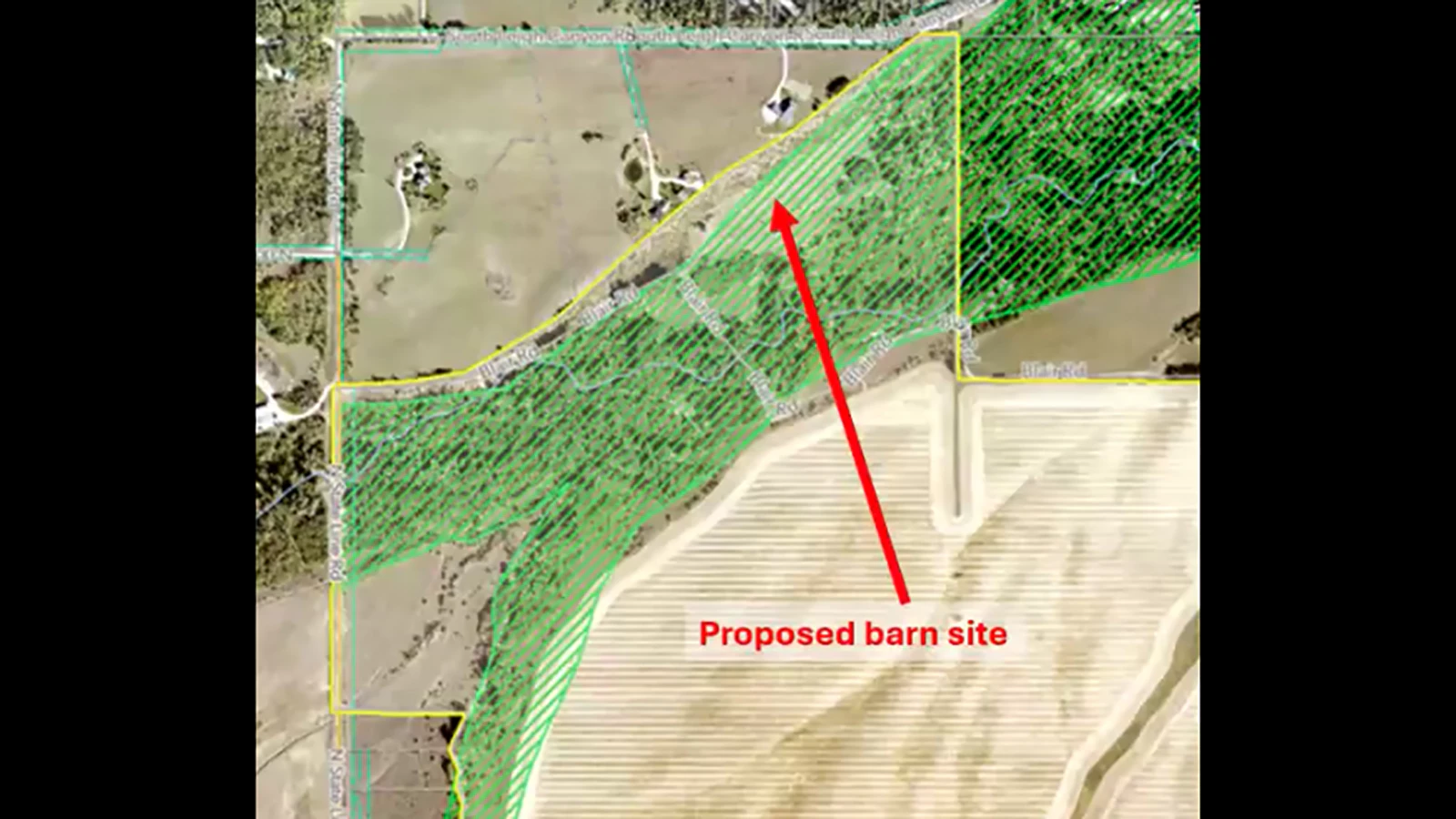 A map presented during the public hearing shows the proposed barn site within the South Leigh Creek Natural Resource Overlay