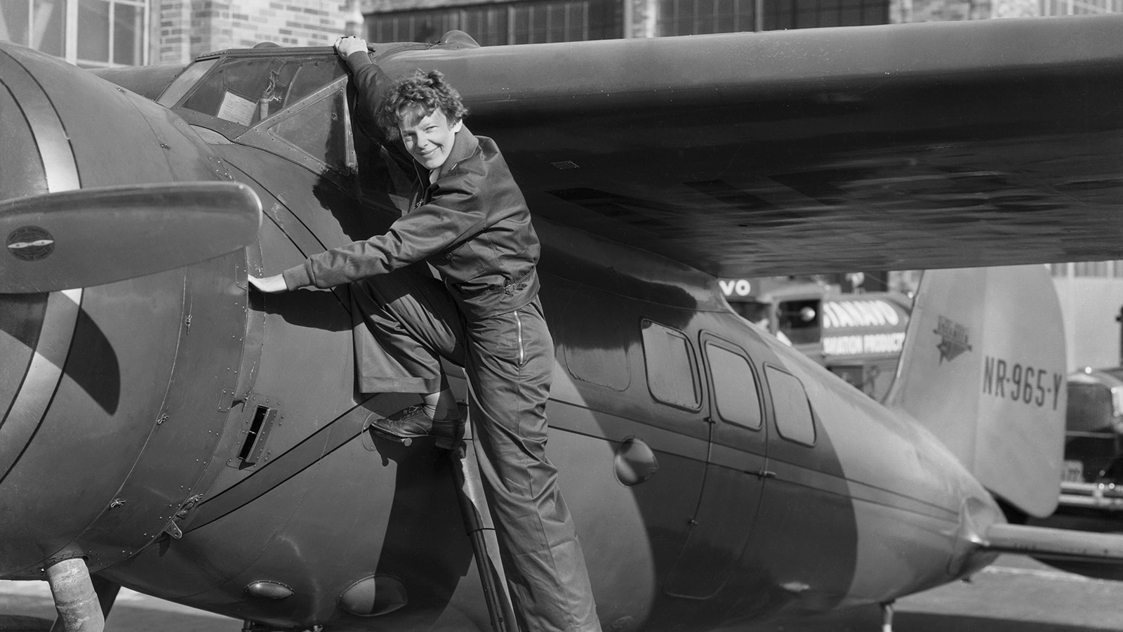 Amelia Earhart climbing into the cockpit of an aircraft in this undated photo.