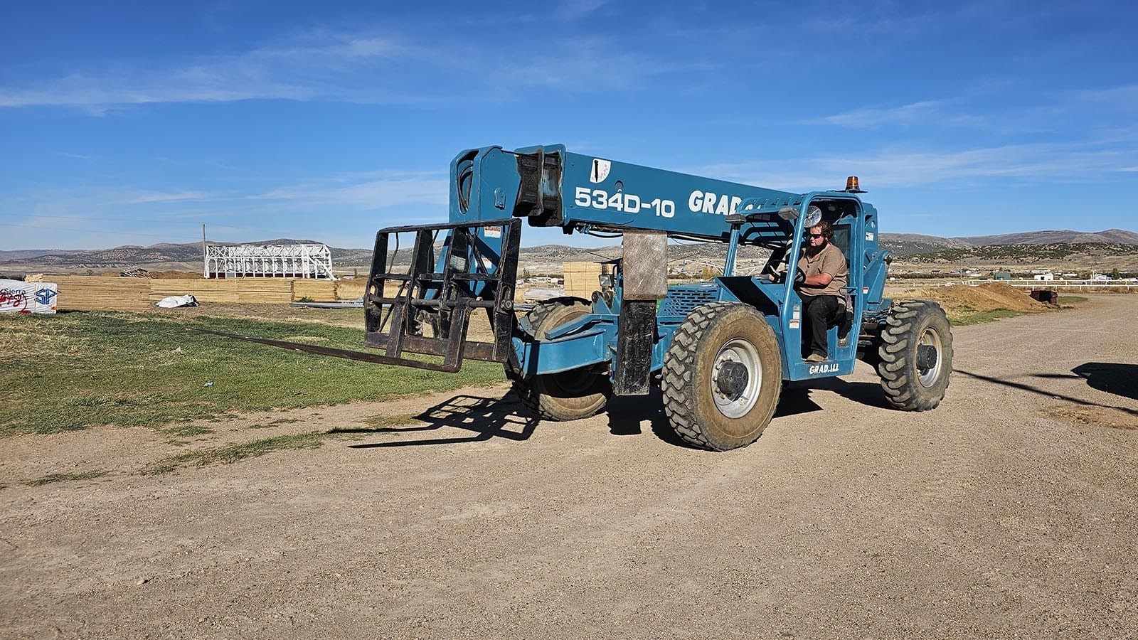 An Amish man from Ohio drives this forklift like a pro. The Amish are usually thought of as adverse to using technology, but it's no longer completely restricted in some sects. This group allows using it for commercial operations, so they are more competitive than they could be with just hand tools.