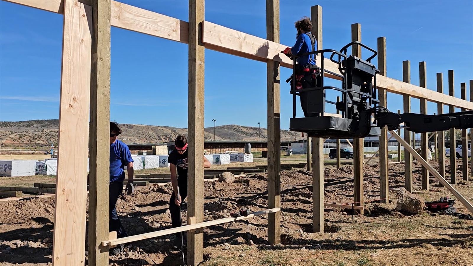 Adam Mast, top, is Amish but uses a nail gun like he was born with it in his hand. Using all hand tools is just one of many stereotypes that don't always apply to the Amish any more.