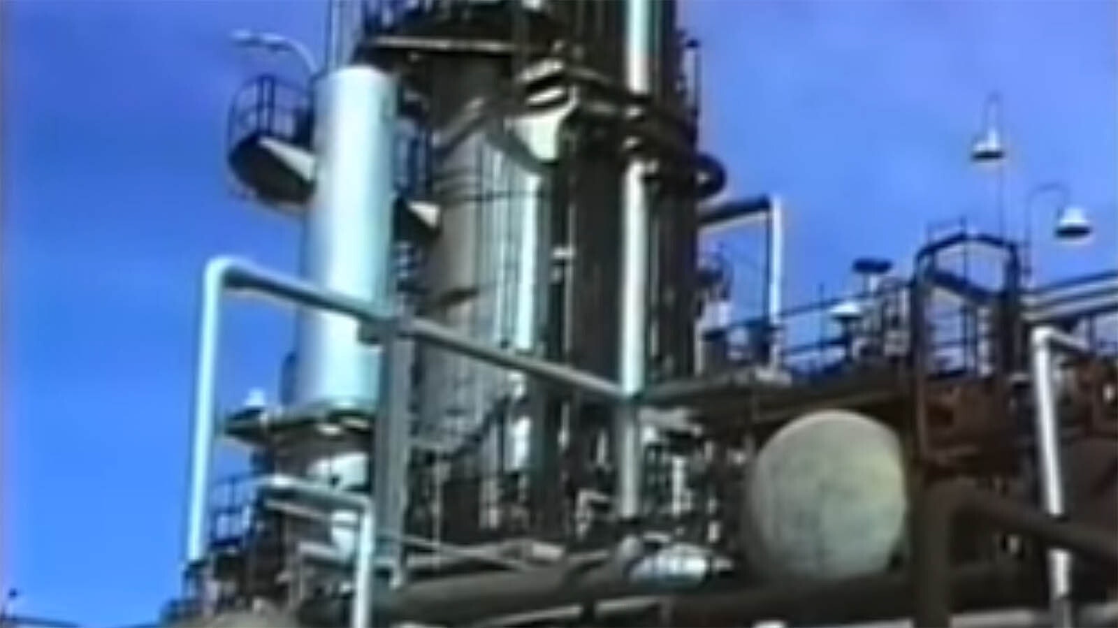 Images from a grainy 1991 YouTube video of the old Amoco refinery in Casper, Wyoming.