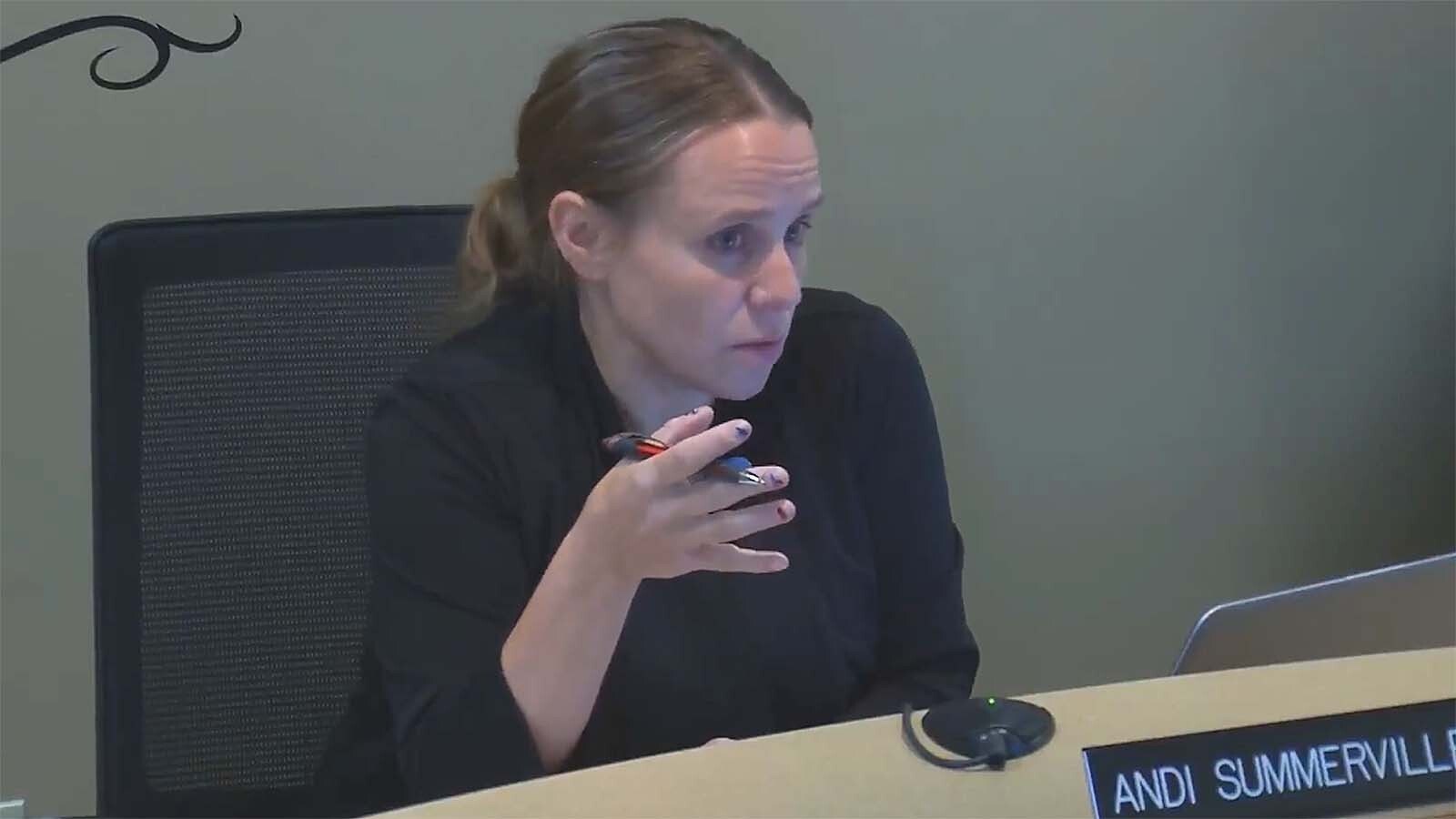 Former Laramie mayor and lobbyist Andi Summerville is accused of stealing over $31,000 from a Wyoming mental health nonprofit she led, facing eight felony charges after investigators found unauthorized purchases and self-written checks. She's pictured here in a screenshot from a July 18, 2017, city council meeting.