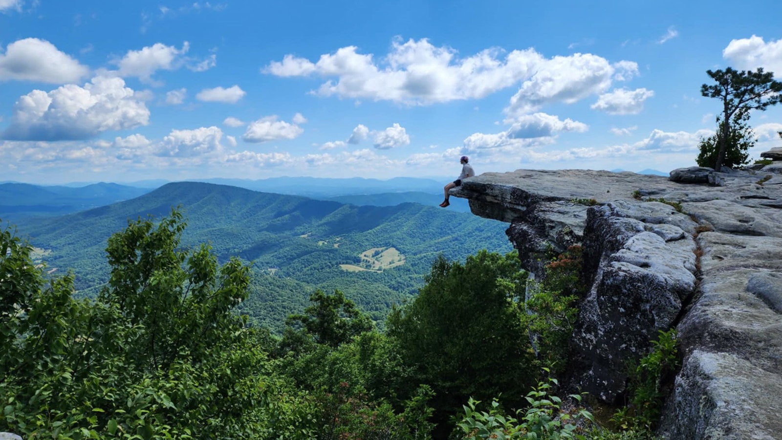 Jordan Thorn sits on the edge of McAfee Knob in Virginia.