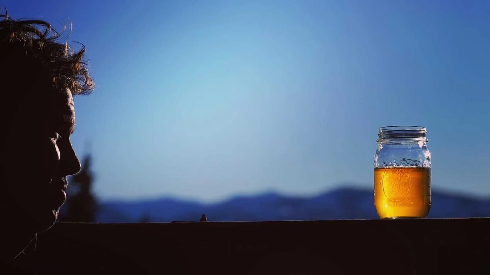 Cider in a mason jar at sunset in Jackson Hole.