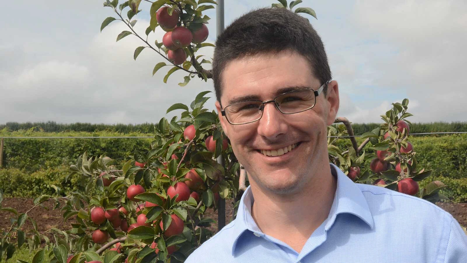 Jonathan Magby in a Wyoming apple orchard.