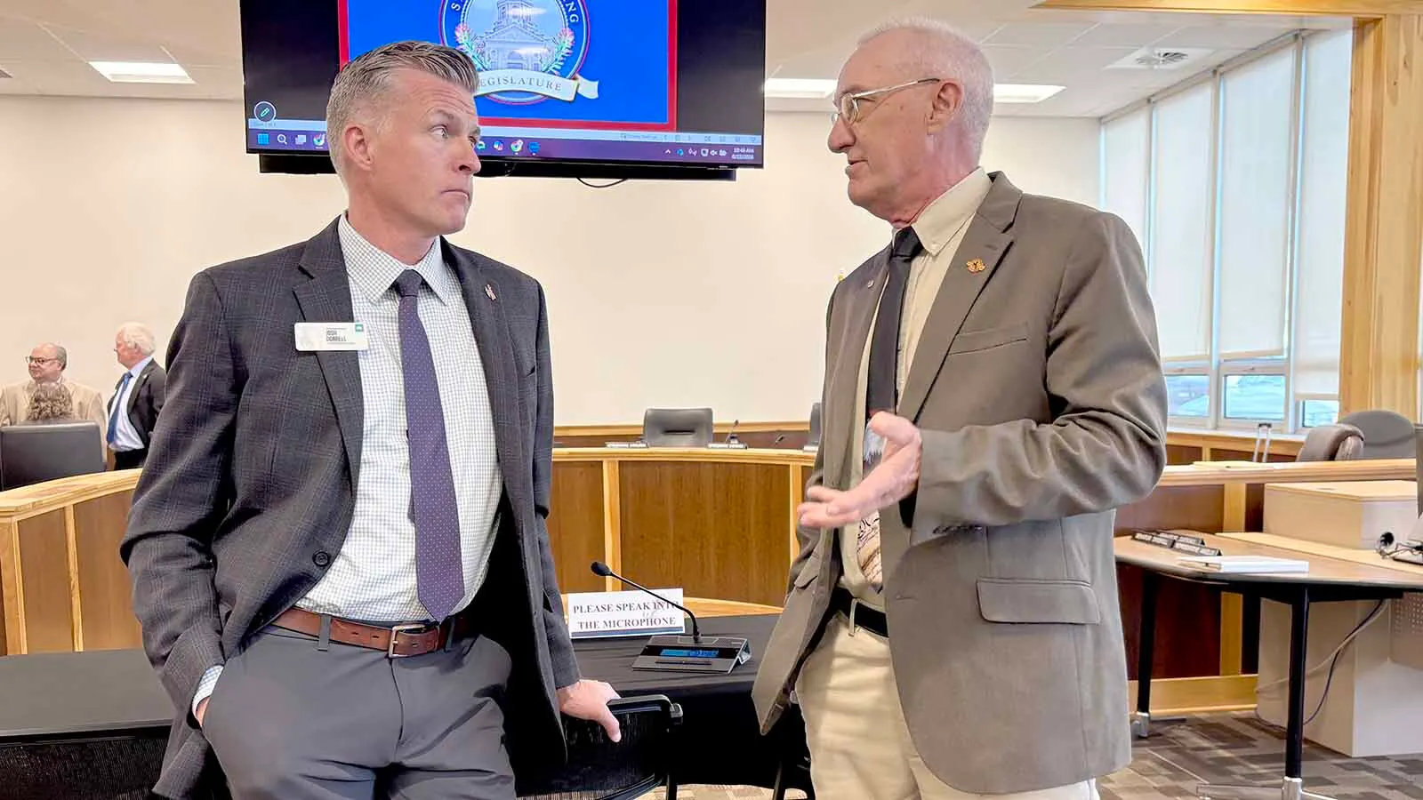 Wyoming Business Council director Josh Dorrell, left, talks with stat Rep. Ken Pendergraft, R-Sheridan, during a break of the Joint Appropriation Committee's meeting Monday, June 22, 2026.