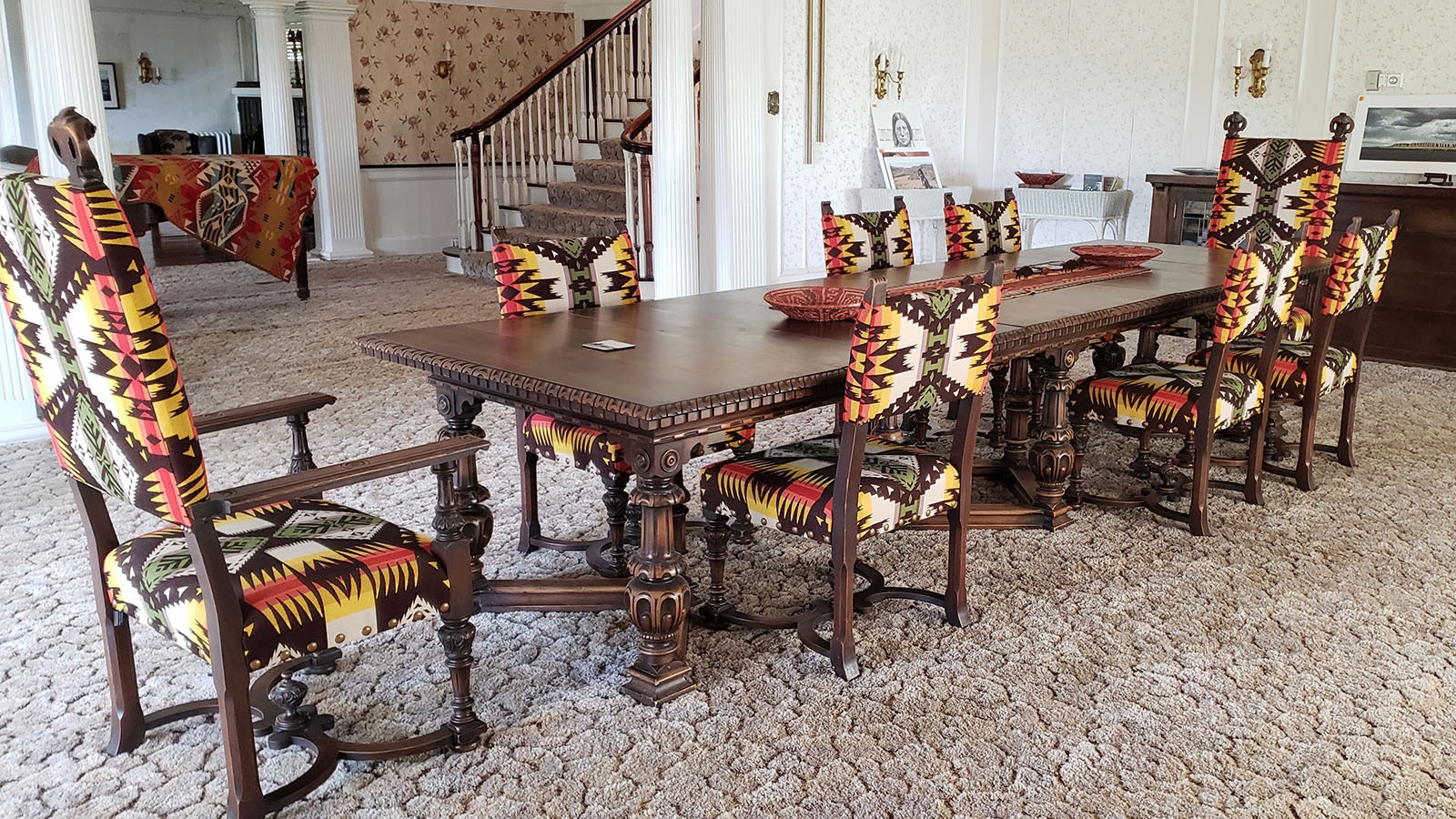 The dining table is original to the Arapaho Ranch as are the chairs, but they've been reupholstered.