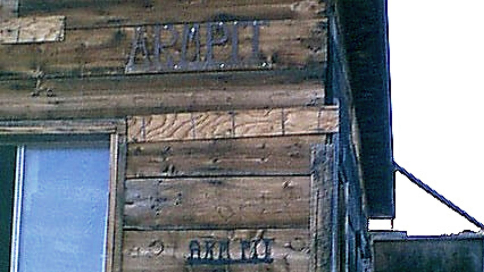 A simple cabin sign designates the official Armpit, Wyoming.