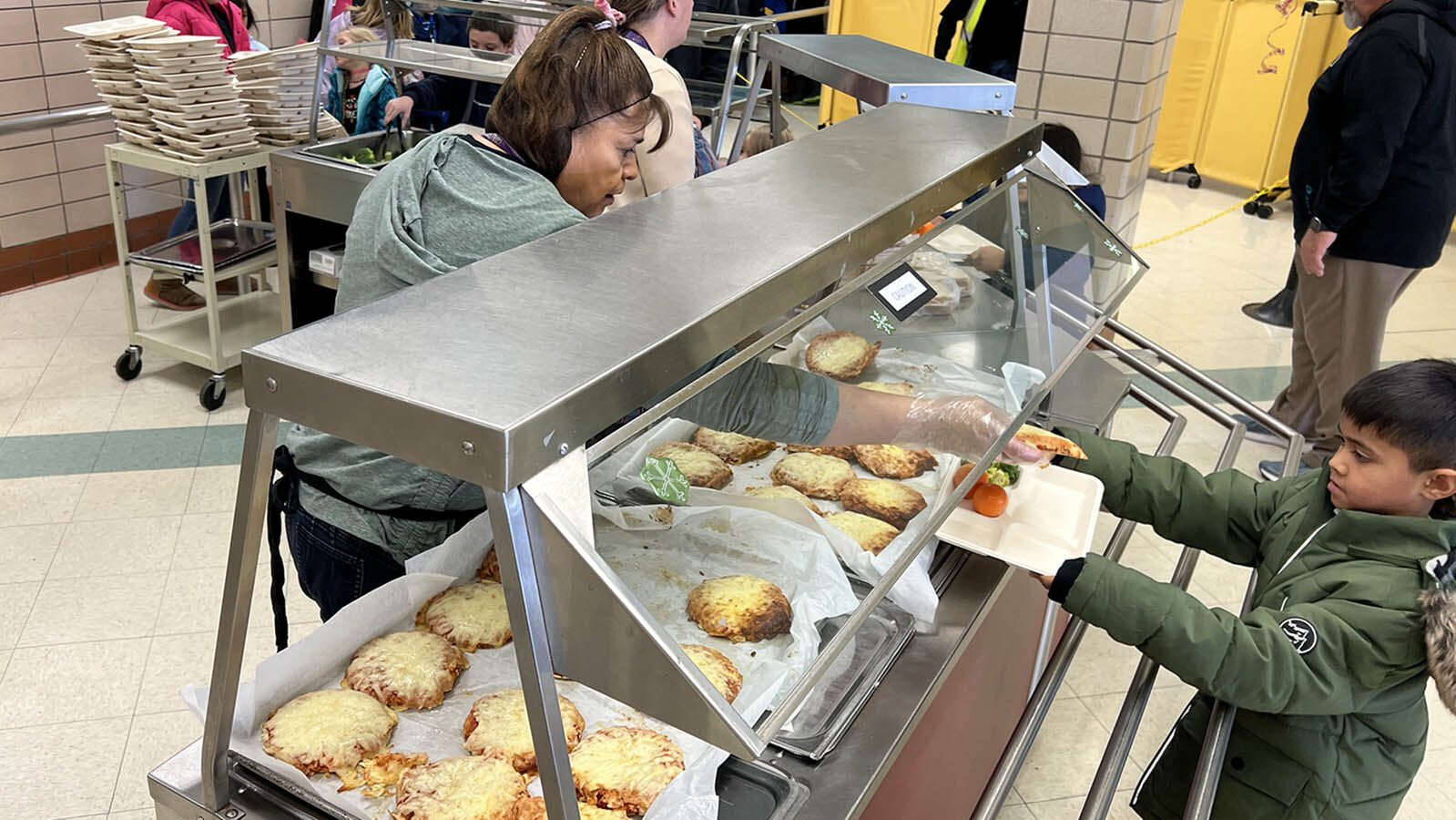 Frances Vigil is one of the most popular people in school on pizza day at Arp Elementary School in Cheyenne.