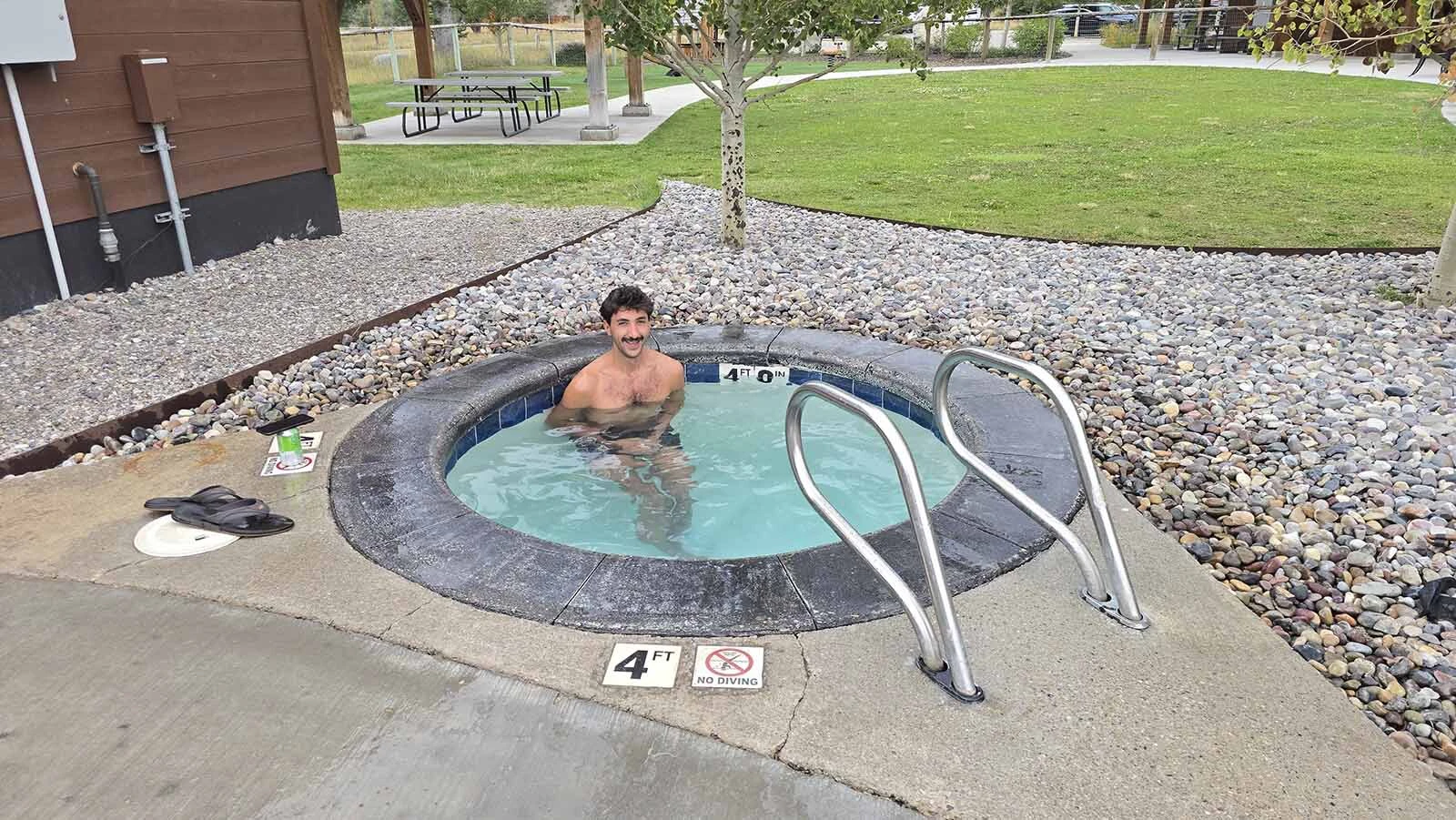 A brave soul tries the polar plunge at Astoria Hot Springs Park in Jackson Hole.