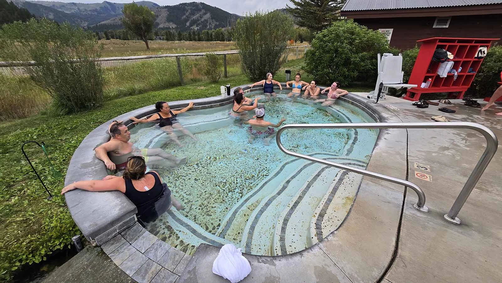 People gather in one of six soaking pools at Astoria Hot Springs Park in Jackson Hole.