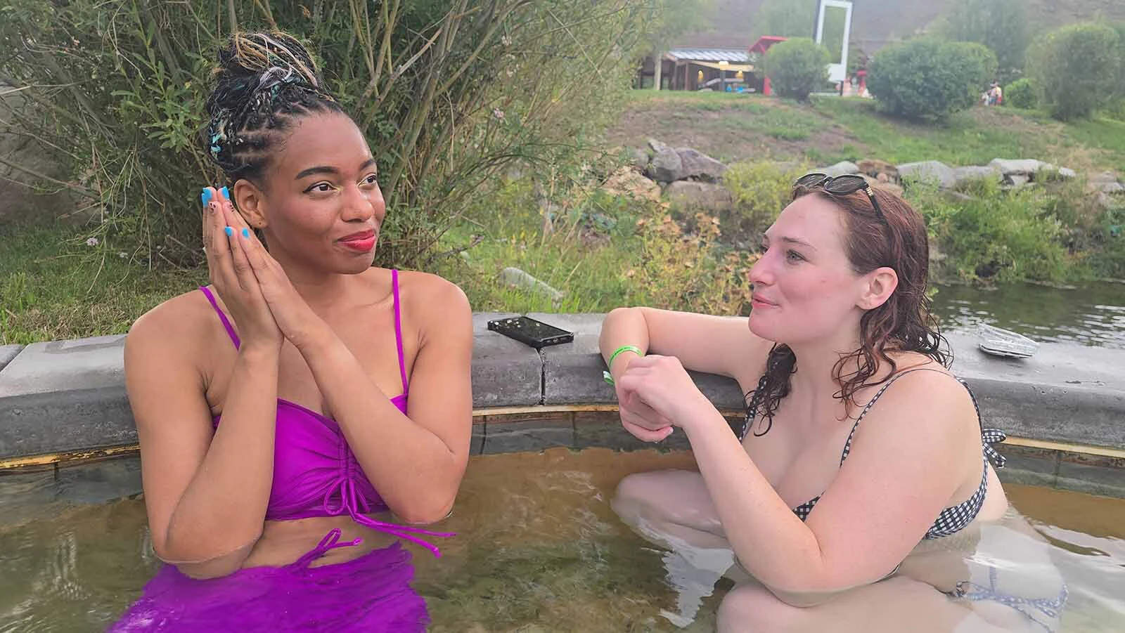 Iyonna Young and Sarah Kelly talk about their dream Jackson Hole vacation with Cowboy State Daily during a soak at Astoria Hot Springs Park.