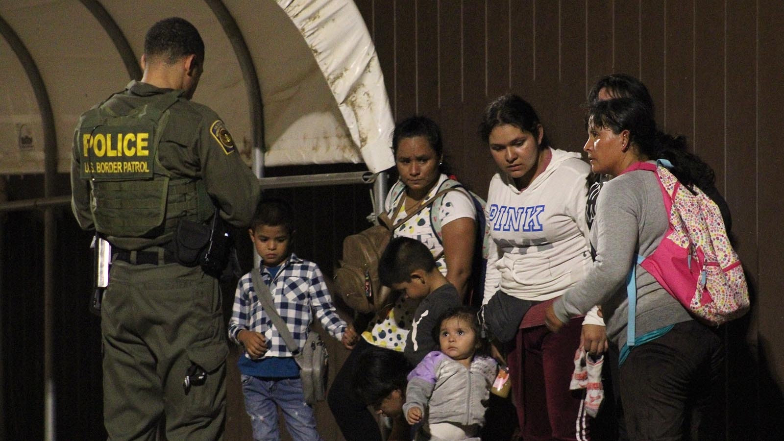 A U.S. Border Patrol agent documents a group of illegal immigrants who crossed into the United States near Yuma, Arizona, in the early morning hours of Aug. 2, 2024.