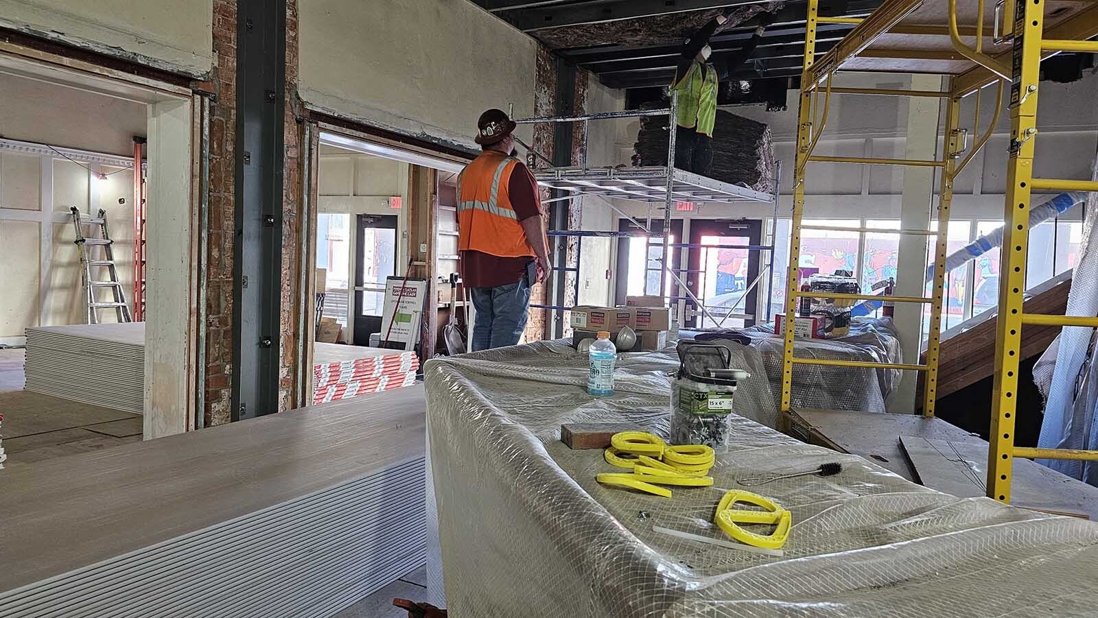 Two workers were installing insulation this past week in preparation for installing fire-resistant gypsum sheetrock over new steel beams.