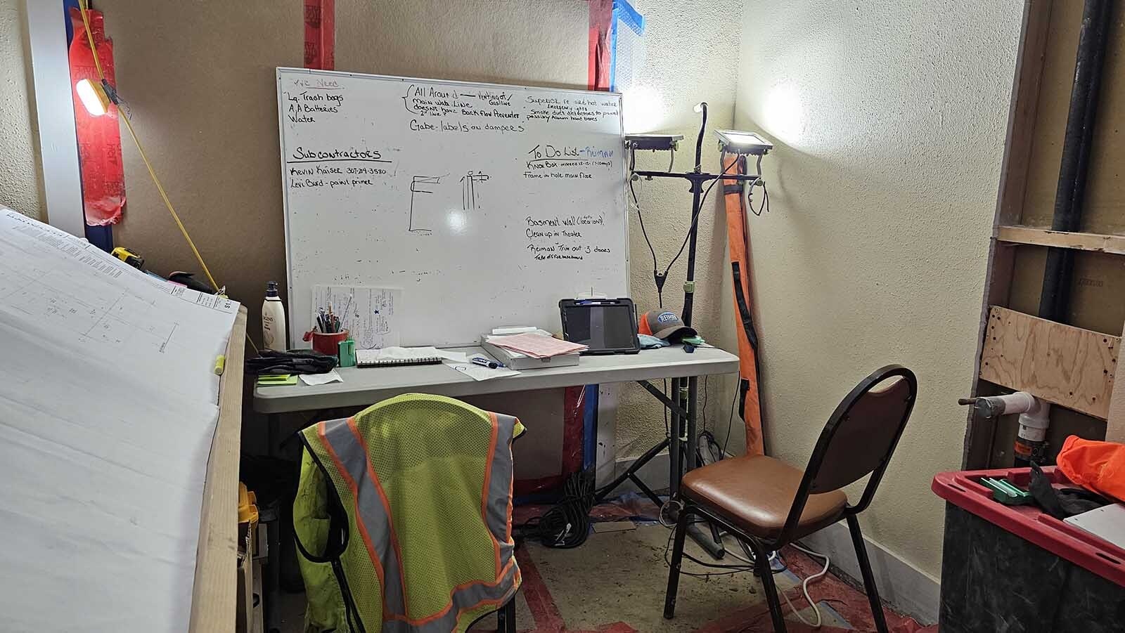 The "war" room is a simple folding table and chairs, with a dry erase board inside the Atlas Theatre.