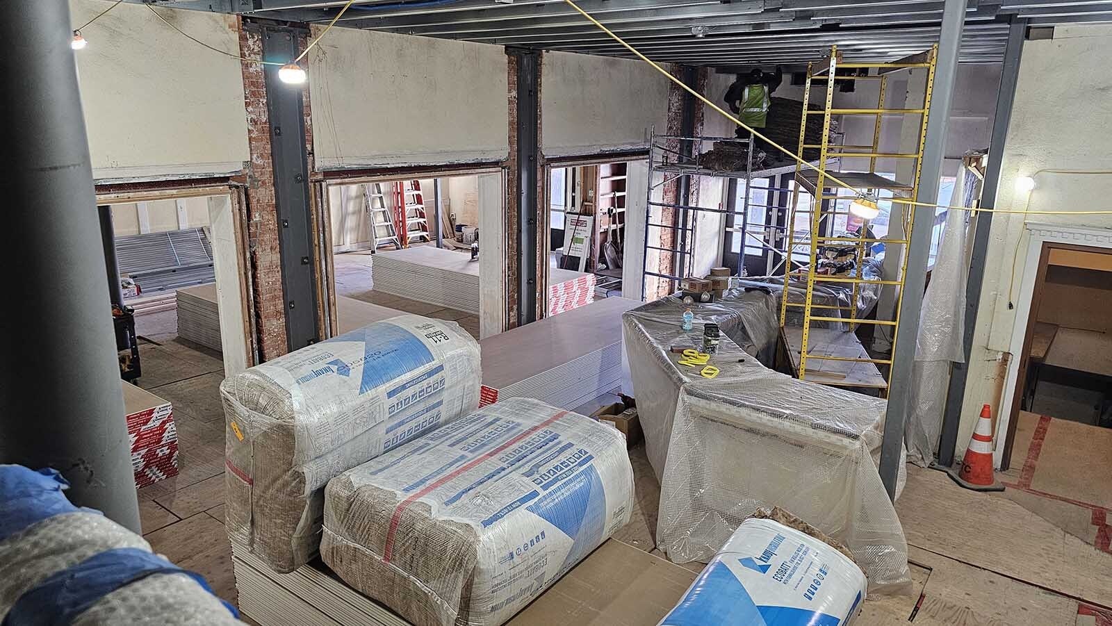 Fire-resistant sheetrock and insulation are being installed at the Atlas Theatre, after structural repairs required adding steel beams and girders.