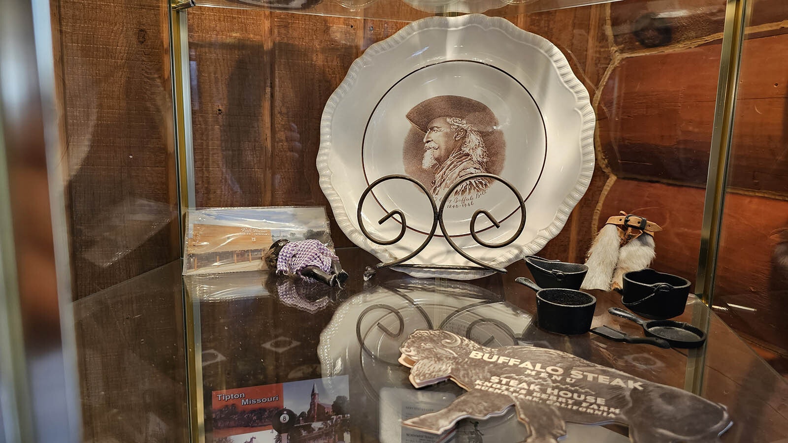 A plate with Buffalo Bill Cody, and an original 1898 program for his Wild West Show.