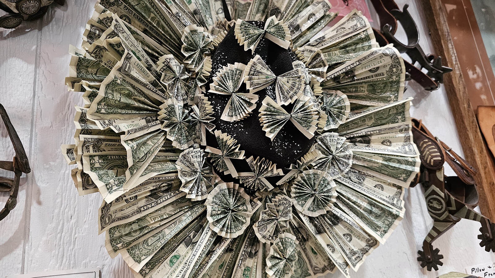 This hat is made of more than 100 $1 bills. Happy birthday!