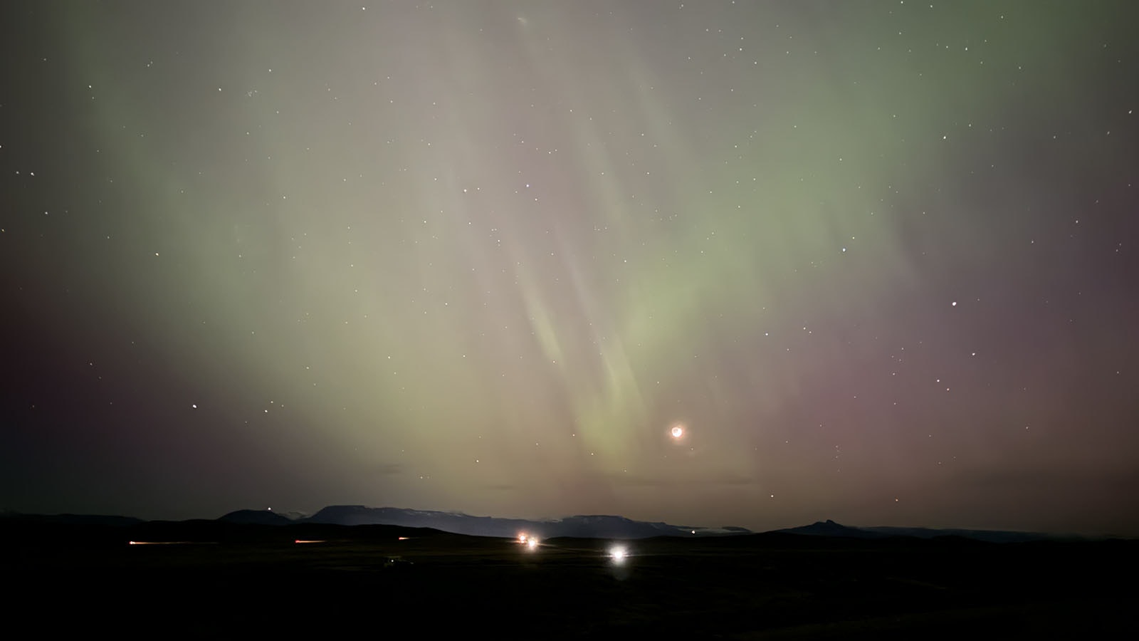 The May 10 aurora seen from Eagle Pass South between Cody and Greybull. The aurora was created by the convergence of five chronal mass ejections from a massive sunspot, which will be turned toward Earth again in early June.