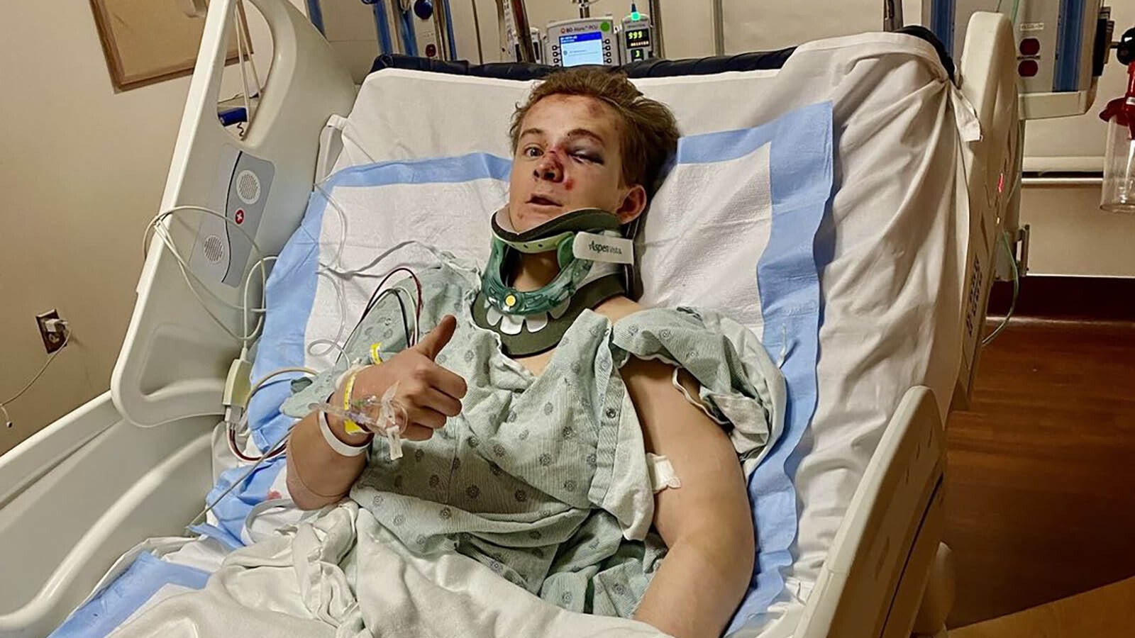 Casper College bareback rider Austin Broderson gives a thumbs up from a hospital bed in Denver after suffering a horrific crash riding in the National Western Stock Show Rodeo on Jan. 15, 2023.