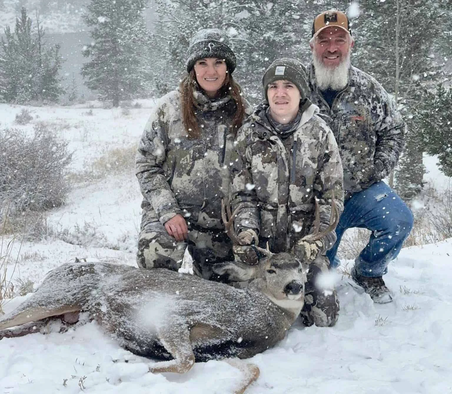 Marty Dupertuis Jr. poses with his parents, Marty and Maria, during a successful deer hunt.