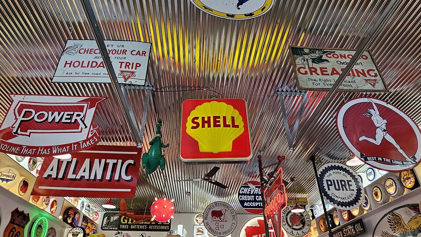 Signs hang down from the ceiling at a vintage automobile-themed Airbnb recently completed by Frontier Auto Museum in Gillette.