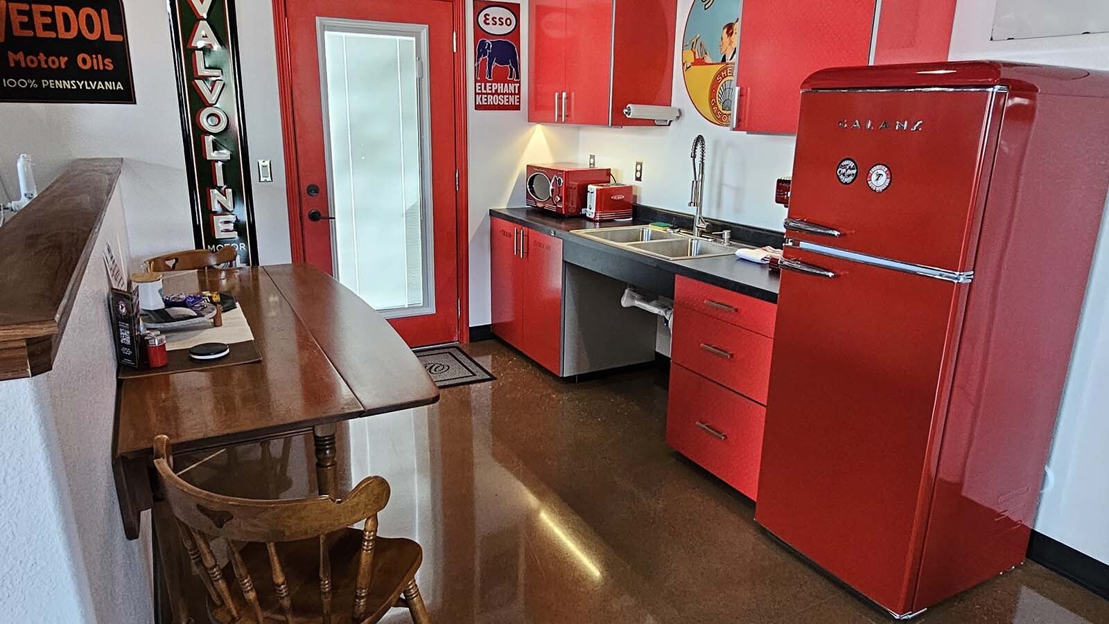 Bright red appliances finish out a  vintage automobile-themed Airbnb recently completed by Jeff Wandler, who owns Frontier Auto Museum in Gillette.