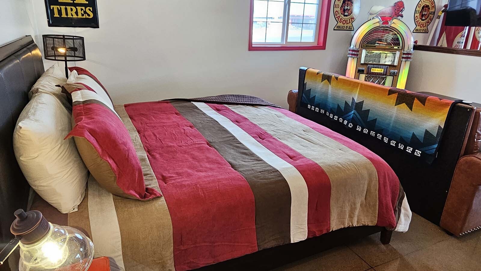 The bed and the couch are perfectly positioned to either watch television, or take in the entirety of  a  vintage automobile-themed Airbnb recently completed by Jeff Wandler, who owns Frontier Auto Museum in Gillette.