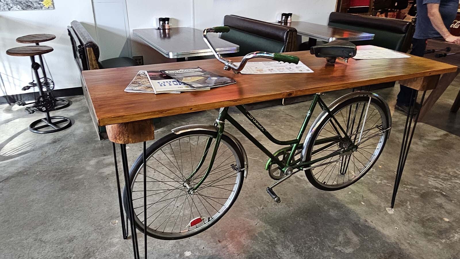 Old bikes made Into unique tables are among the decor at a vintage-themed cafe in the Frontier Auto Museum in Gillette.