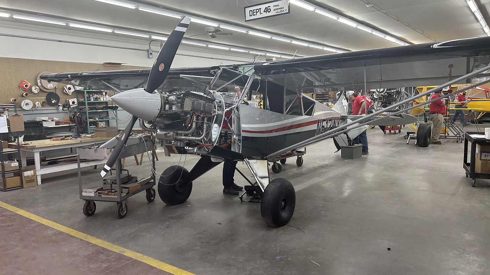 Aviat Aircraft employees work on assembling a new Husky.