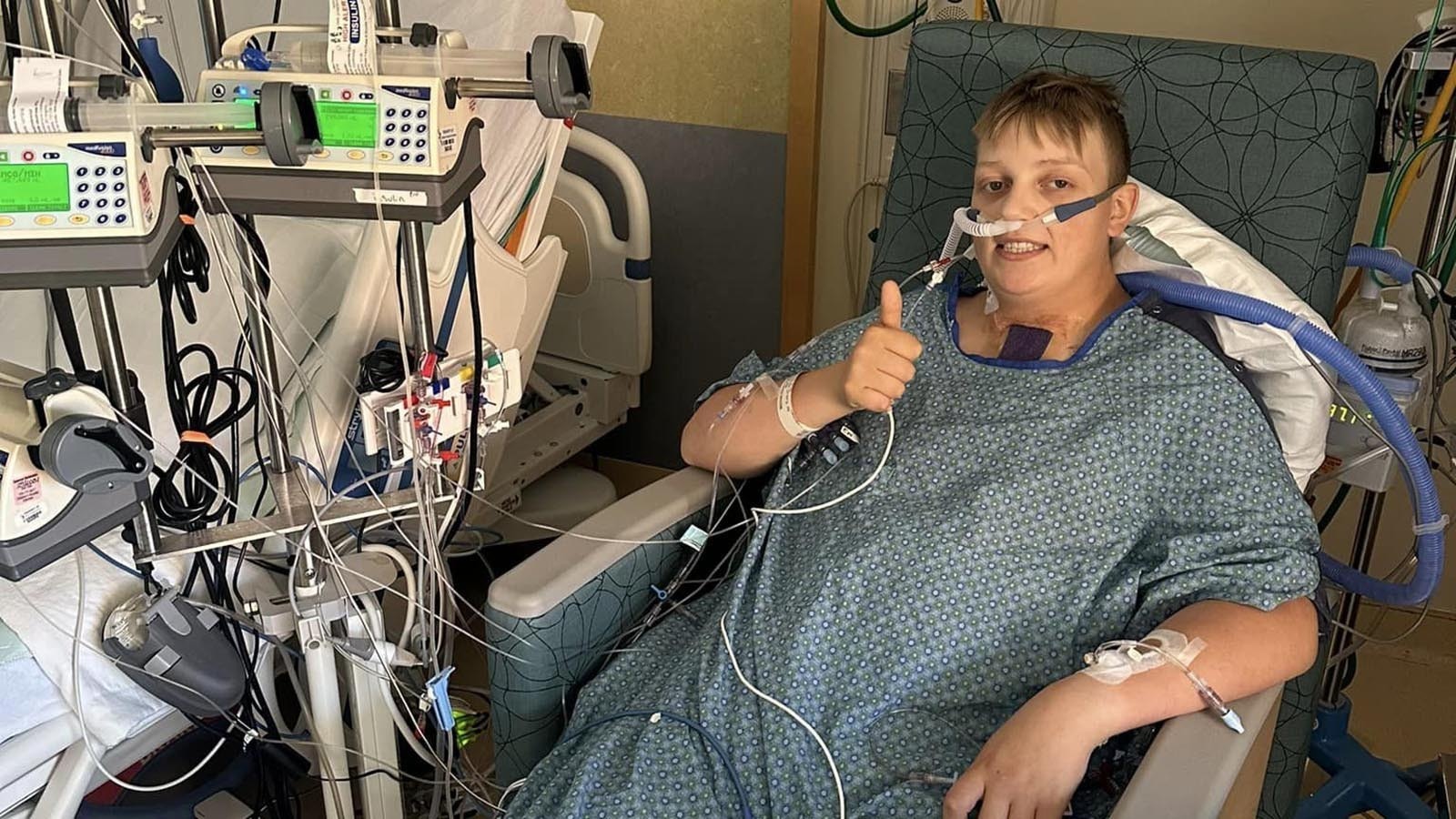 Ayden Skillman of Greybull, Wyoming, gives a thumbs up in the hospital for a heart transplant.