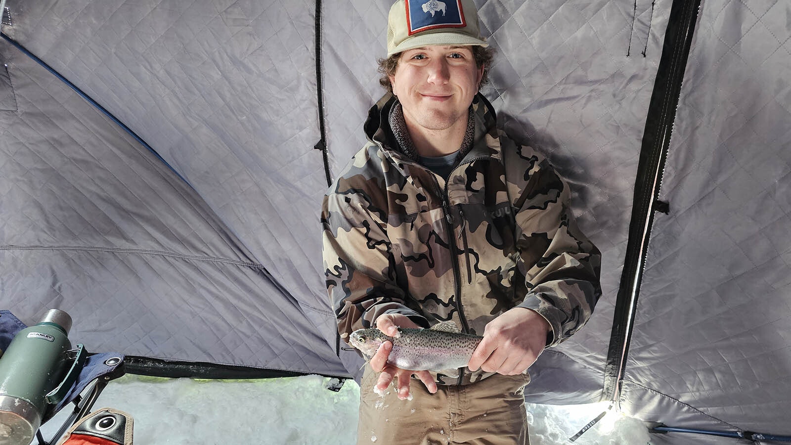 The trout that didn't get away, held by ice fishing guide Isaac Jones from Mississippi.