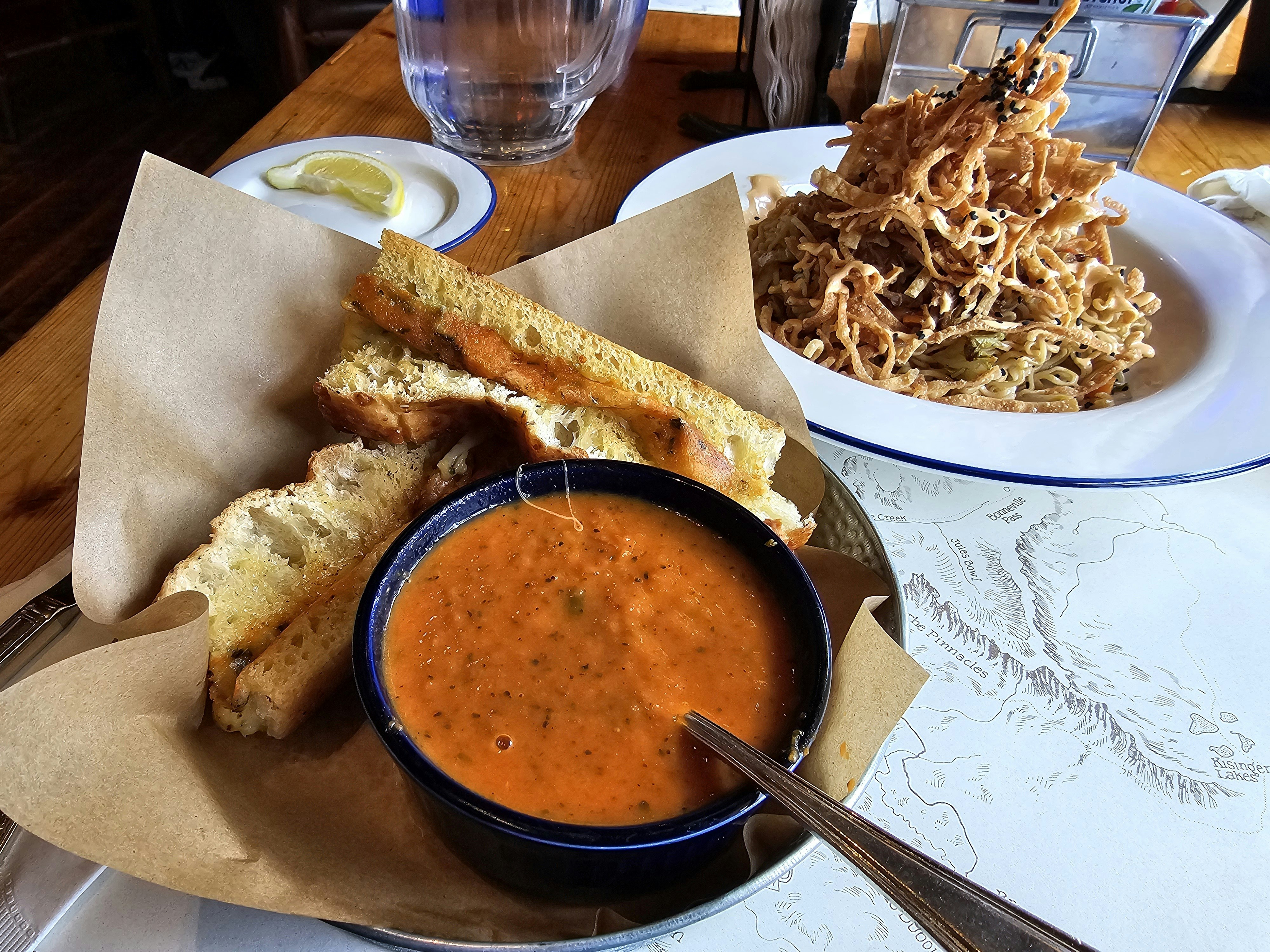 Matchstick cheese sticks and tomato soup with a pulled pork and sesame noodle salad.