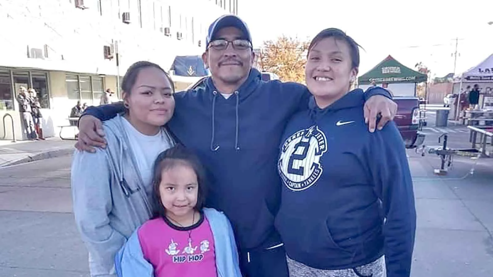 Angelina Bell with her father, Byron Bell, and family.