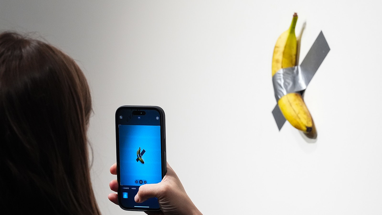 Artist Maurizio Cattelan's "Comedian" — a banana duct-taped to a wall — sold for more than $6 million at a Sotheby's auction Wednesday. As part of the deal, the artist will eat the banana in front of the buyer.