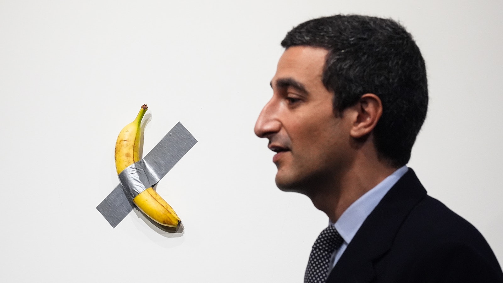 Artist Maurizio Cattelan's "Comedian" — a banana duct-taped to a wall — sold for more than $6 million at a Sotheby's auction Wednesday. As part of the deal, the artist will eat the banana in front of the buyer.