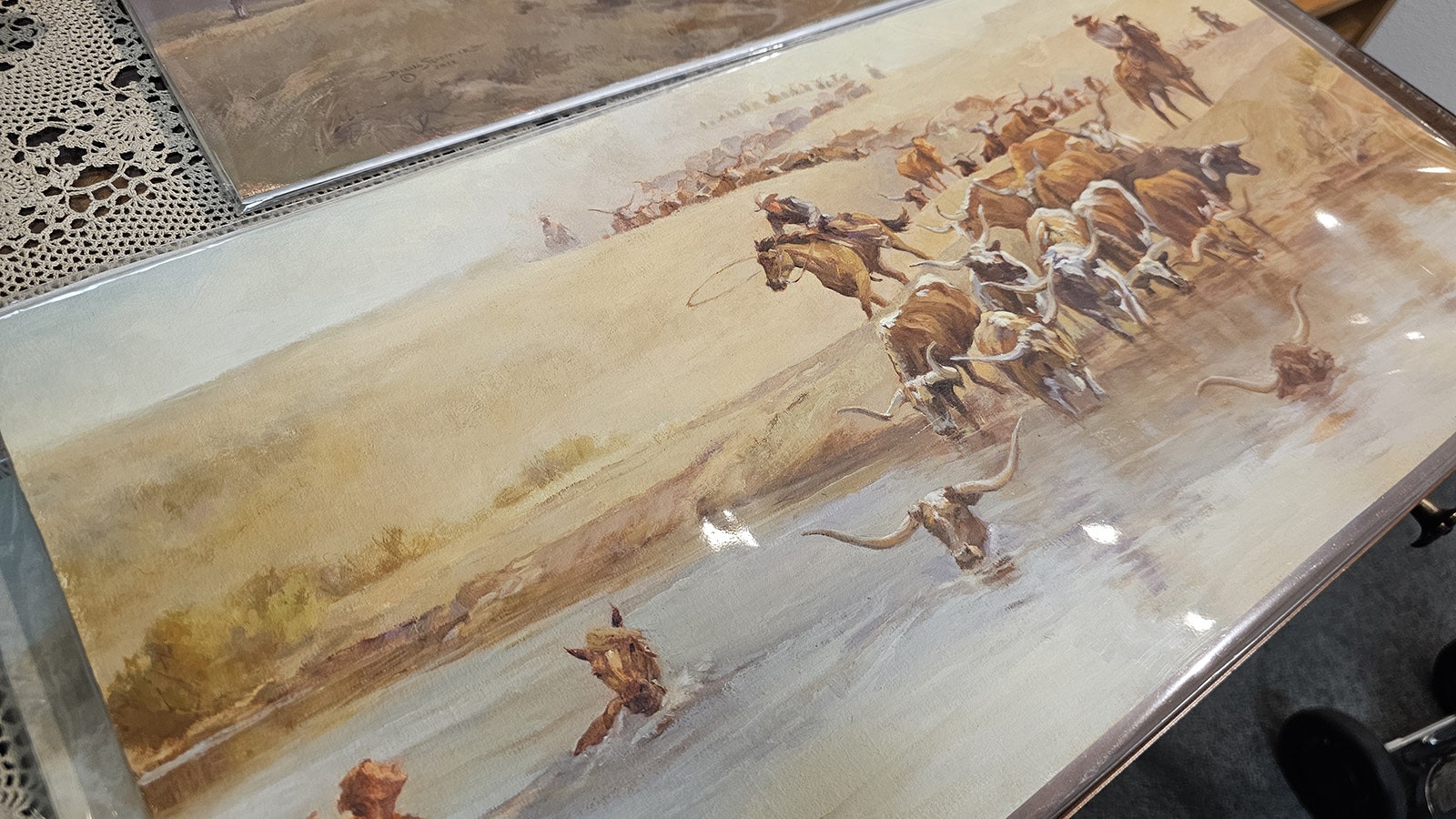 Many a cowboy and many a steer drowned crossing the river on the Texas Trail, which traveled right through Goshen County. The painting is one of five prepared by Barbara Schaffner of Wheatland.