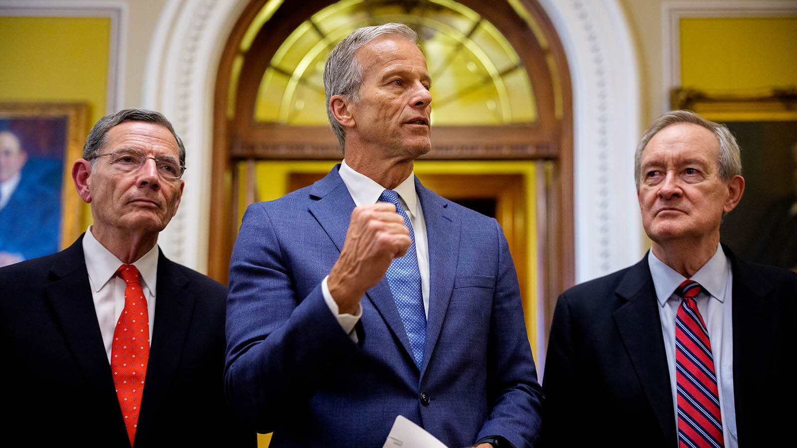 Senate Majority Leader John Thune, R-South Dakota, (center), accompanied by Sen. John Barrasso, R-Wyoming, (left), Sen. Mike Crapo, R-Idaho, speaks to reporters off the Senate floor after the Senate passes President Donald Trump's so-called One, Big, Beautiful Bill Act — stripped of its title to just The Act — at the U.S. Capitol Building on July 1, 2025, in Washington, D.C. U.S. Vice President J.D. Vance was the tiebreaking vote.
