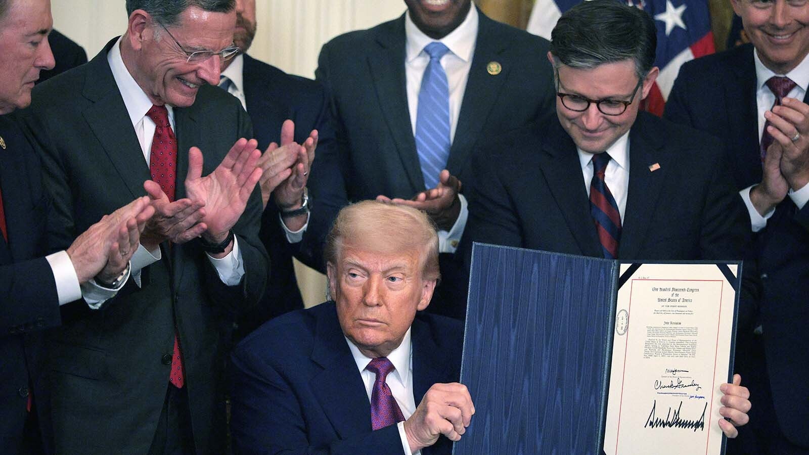 Wyoming U.S. Sen. John Barrasso, second from left, applauds behind President Donald Trump after he signed bills to end the so-called California EV mandate Thursday, June 12, 2025.