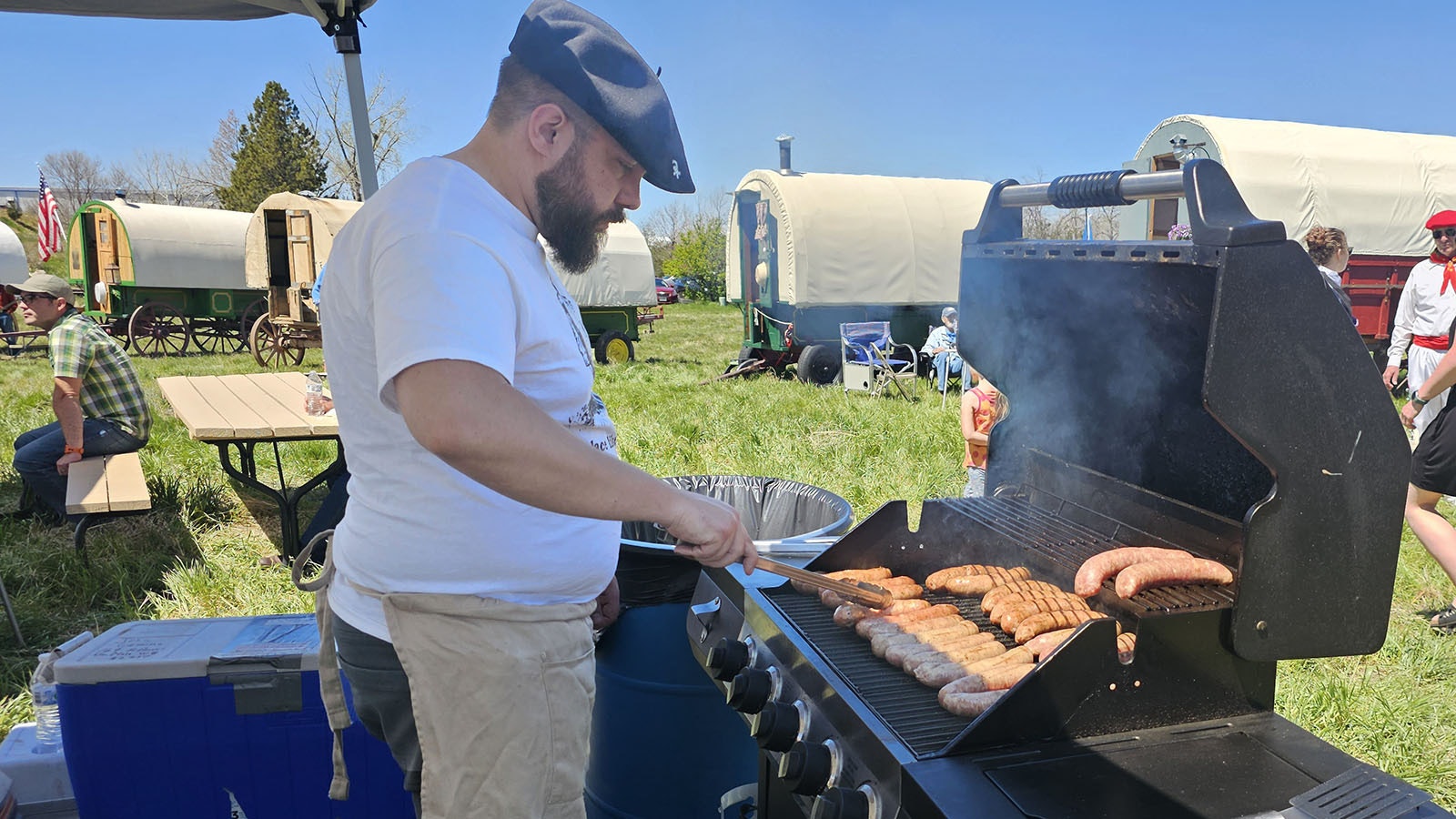 Randy Camino keeps the Lukainka, Basque sausages, turned over a smoky grill.