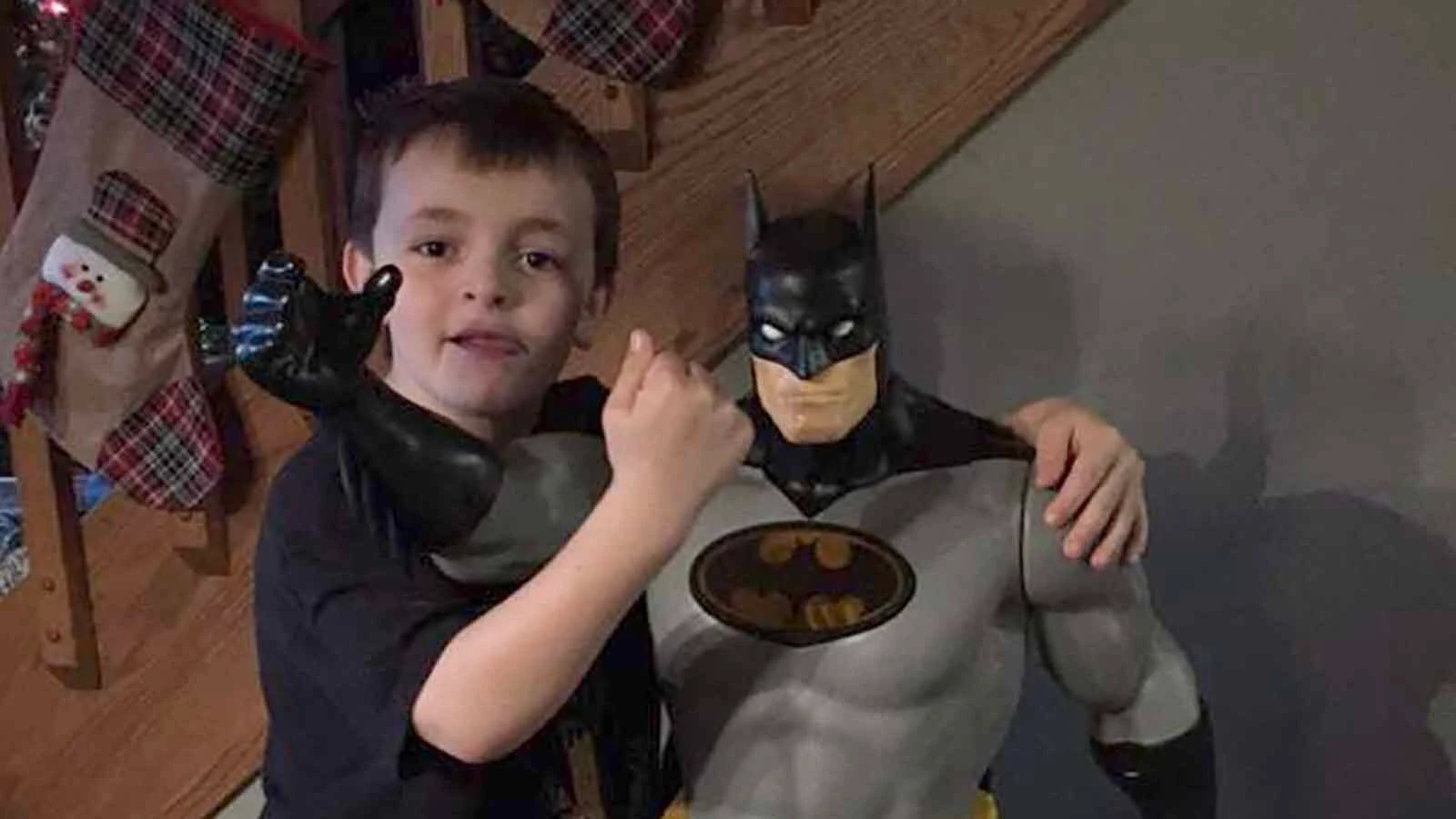 Issac Sweitzer with one of his Batman toys.