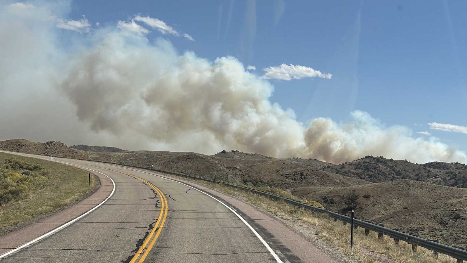 Smoke rises from the Bear Creek Fire in east-central Albany County.