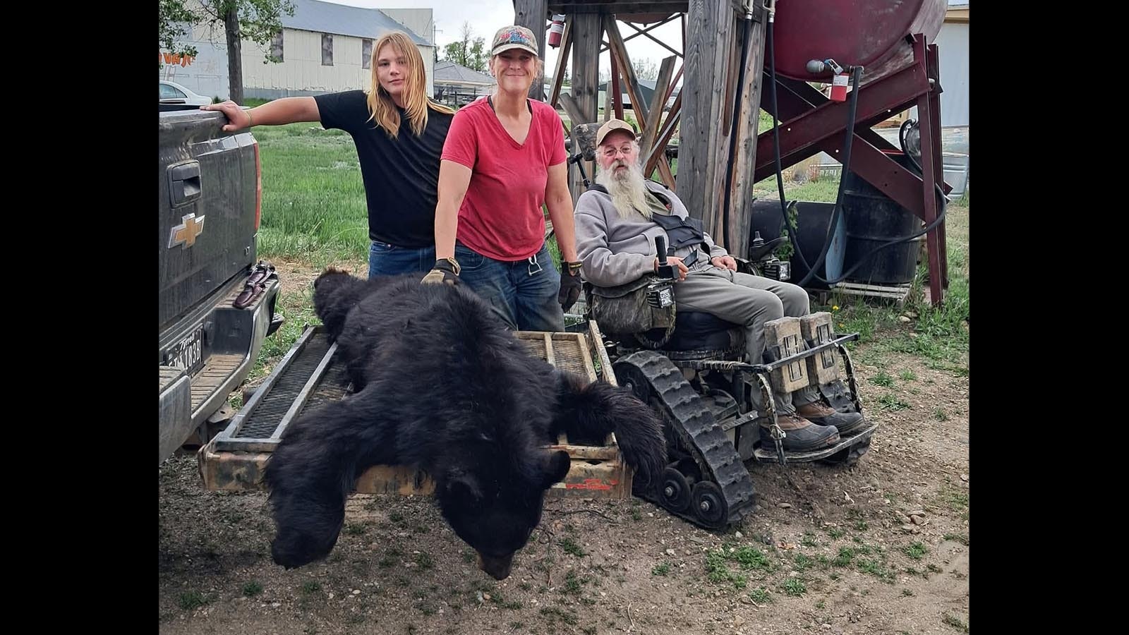 Julie Mccallister of Rock River celebrates successful 2025 spring black bear hunt with her husband, Blaine, and grandson Remington. The 2026 spring bear hunt is set begin in April.